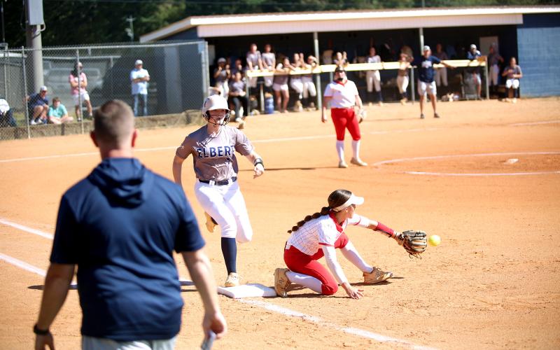 Audrey Lunsford (9) makes it to first base. (Photo by Bo Underwood)