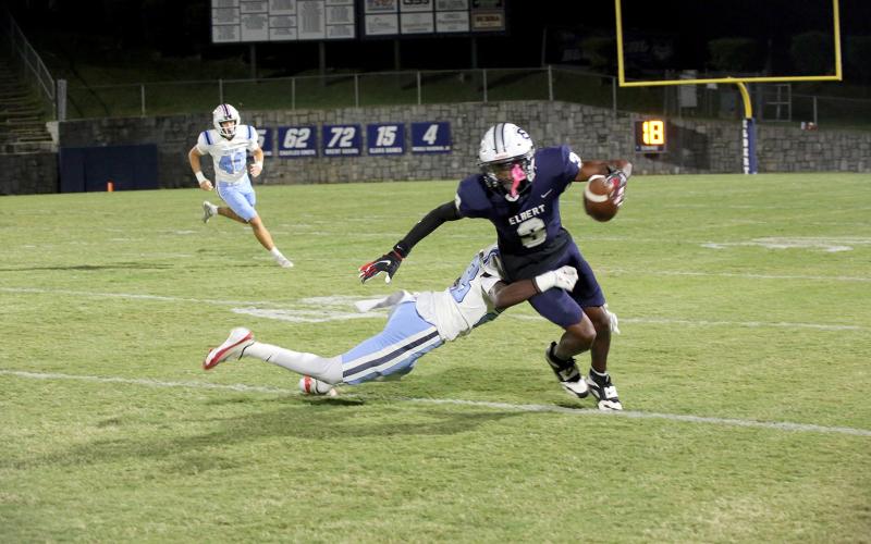 D.K. Winn (3) slips a tackle n Elbert’s 43-9 win over Providence Christian. (Photo by Bo Underwood)