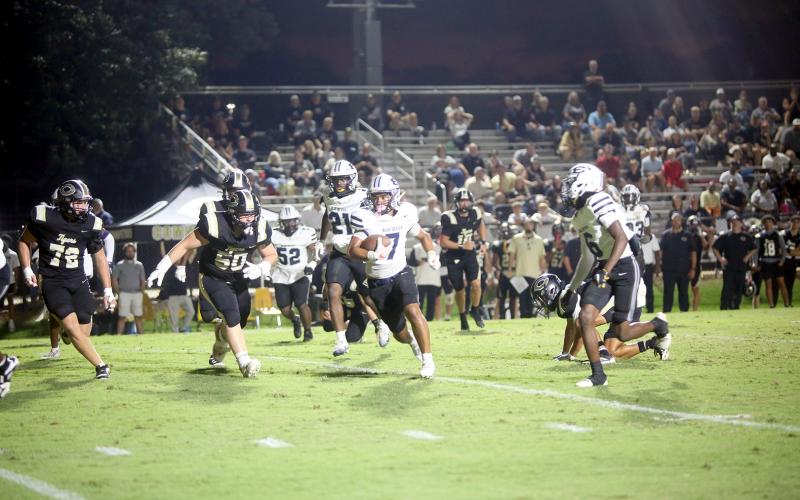 Elbert defensive back Jose Rodriguez (7) returns an interception for a touchdown in Elbert’s 16-6 win over Commerce on Sept. 26. (Photo by Bo Underwood)