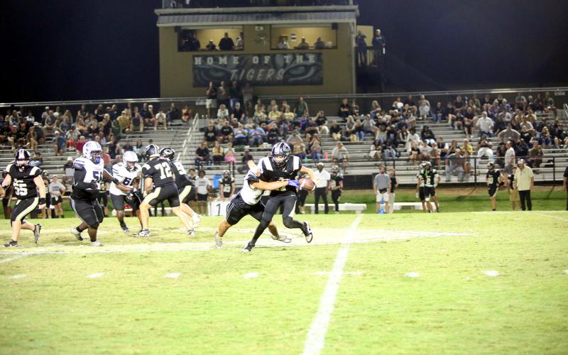 Kaden Montgomery (17) forces a fumble to seal Elbert’s 16-6 road victory over Commerce on Sept. 26. (Photo by Bo Underwood)