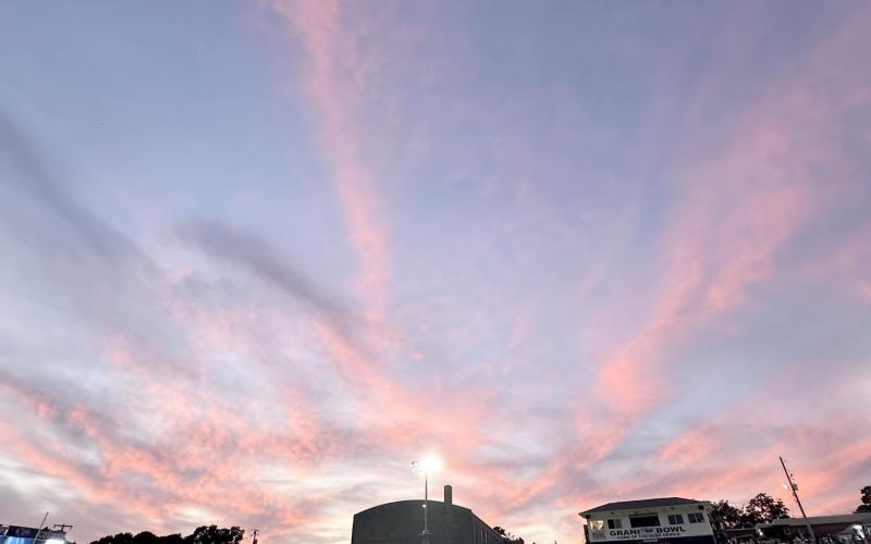 The sky had a pink hue while band members, athletes and fans donned pink attire in honor of Breast Cancer Awareness Month. (Photo by Callie Moss)