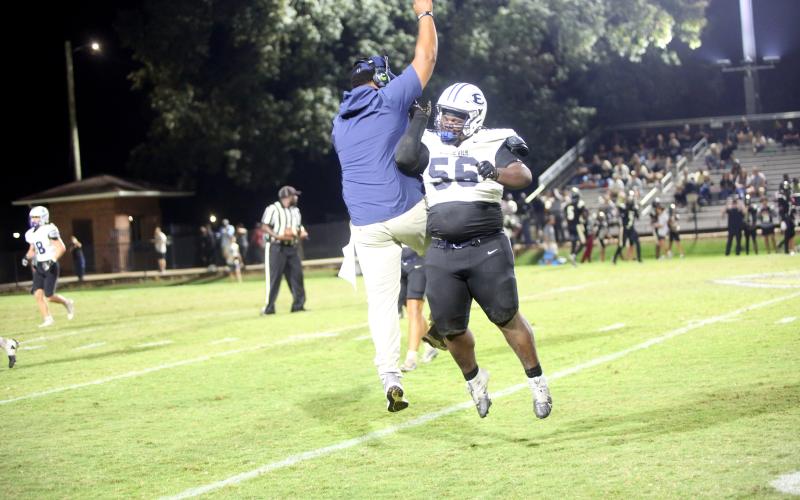 Defensive lineman Jerrell Sims celebrates with Devon Turman after a fumble recovery late in Elbert’s 16-6 win over Commerce on Sept. 26. (Photo by Bo Underwood)