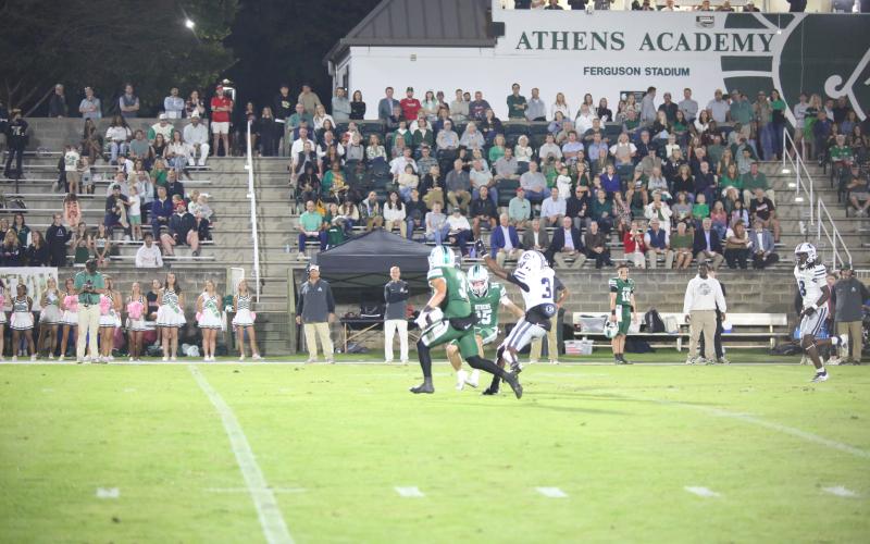 D.K. Winn (3) makes a defender miss in Elbert’s 48-14 loss to Athens Academy on Oct. 17. (Photo by Bo Underwood)