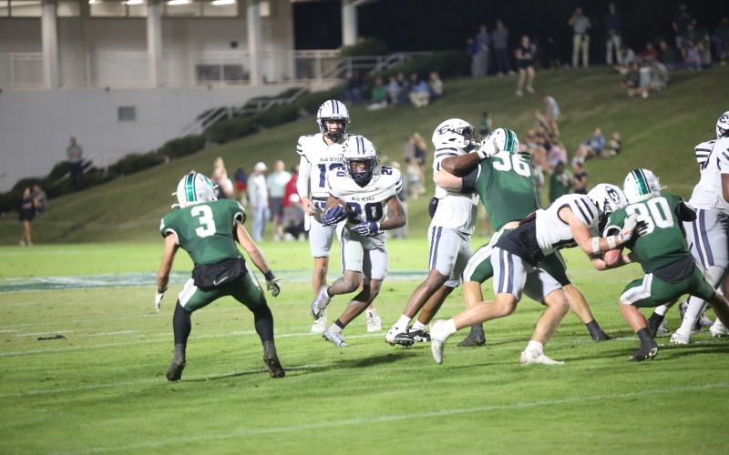 Tyler Turman carries the ball in Elbert’s 48-14 loss to Athens Academy on Oct. 17. (Photo by Bo Underwood)