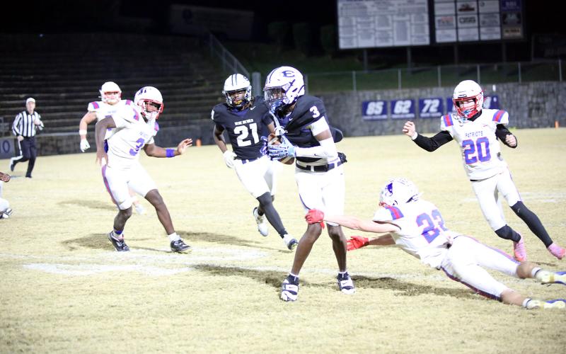 D.K. Winn slips through an Oglethorpe tackle attempt. (Photo by Bo Underwood)