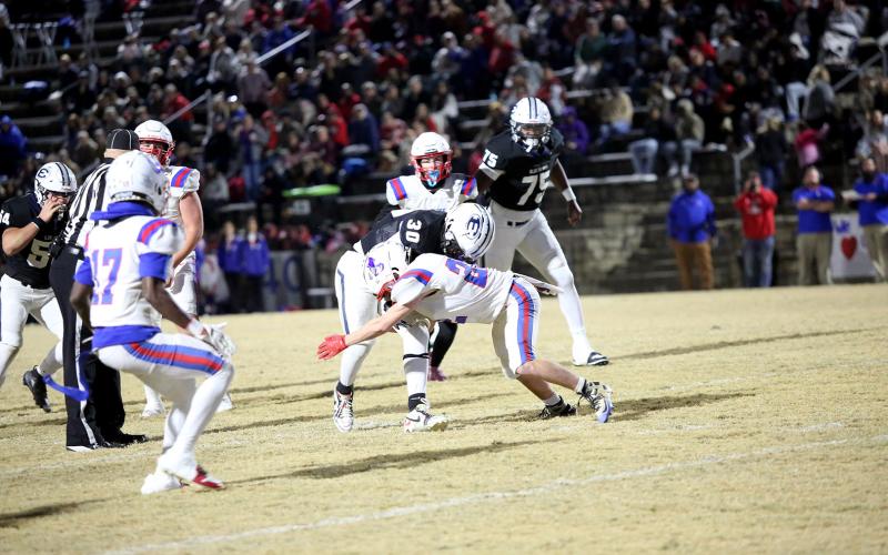 Petey Allen lowers the shoulder on a defender. (Photo by Bo Underwood)