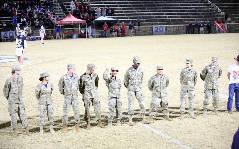 Elbert County’s JROTC Cadets, who finished first in nationals in the rope bridge competition, greet the Elbert crowd at halftime. (Photo by Bo Underwood)