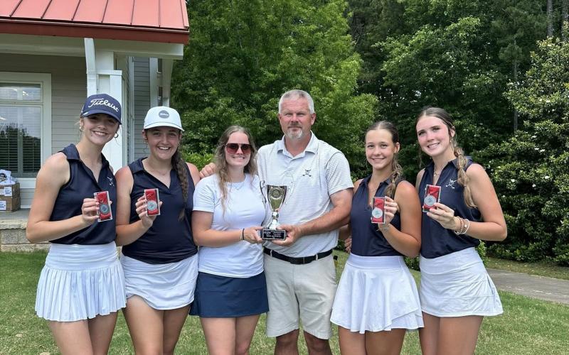 Girls golf coach Larry Kesler (third from right) celebrates with his girls team after finishing second in the state in the GHSA Class A Division 1 State Championship match at Arrowhead Pointe in May. (Photo courtesy of Elbert County Golf)