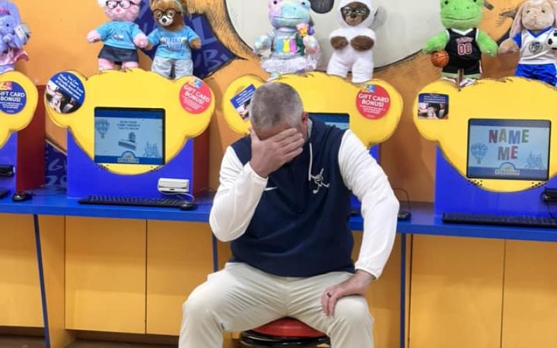 Kesler hides his face while his girls team takes a trip to Build-a-Bear workshop before the first event of their 2024 season. While he may be embarrassed while doing it, Kesler makes sure to mix in fun events with his team throughout the season. (Photo courtesy of Elbert County Golf)