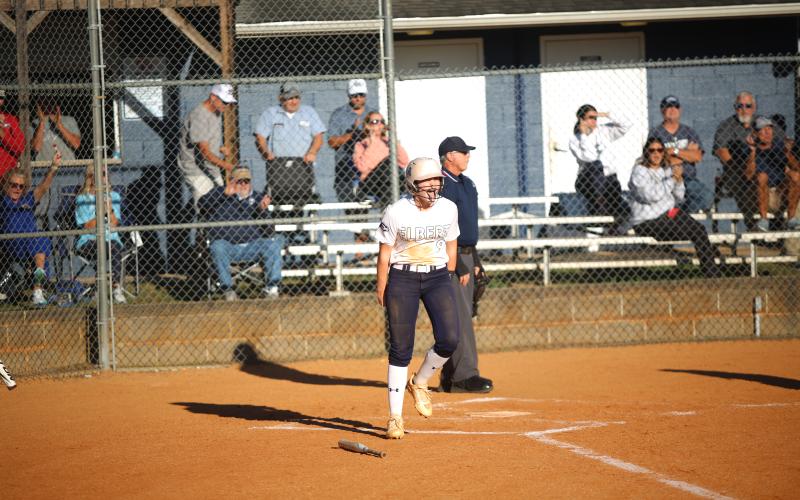 Audrey Lunsford celebrates a run. (File photo by Bo Underwood)