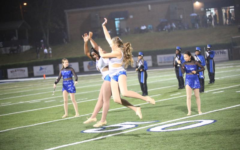 Two Elbert majorettes jump for joy as part of the halftime show. (Photo by Bo Underwood)