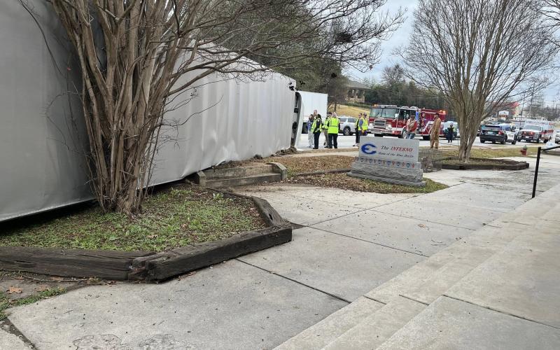 A truck overturns in front of the Inferno. (Photo by Mark Wells)