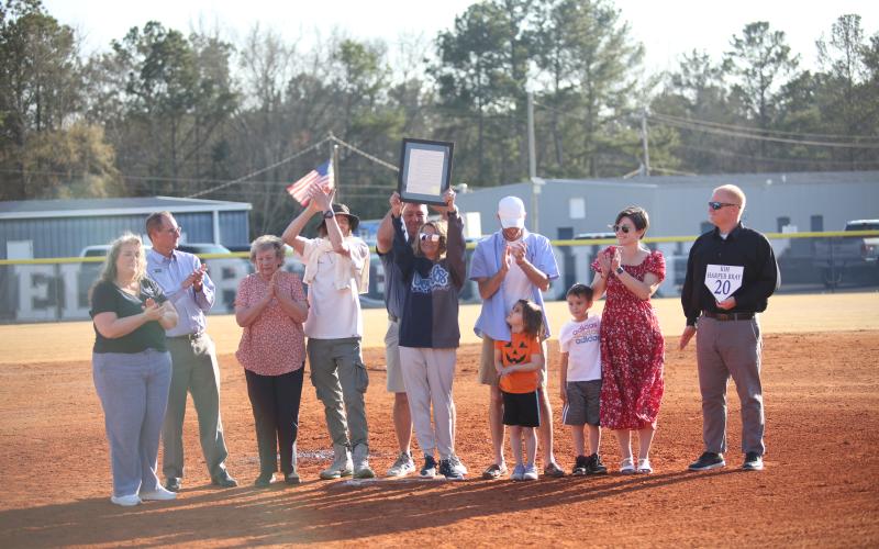 Elbert County legend Kim Bray celebrates alongside her family and Elbert County School District staff after her jersey was retired by Elbert County Softball. (File photo by Mark Wells)