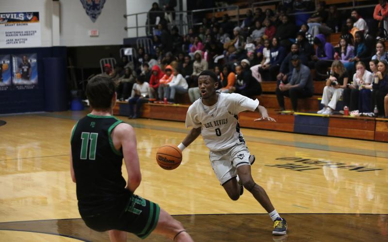 Jordan Morrison attacks the basket. (Photo by Bo Underwood)