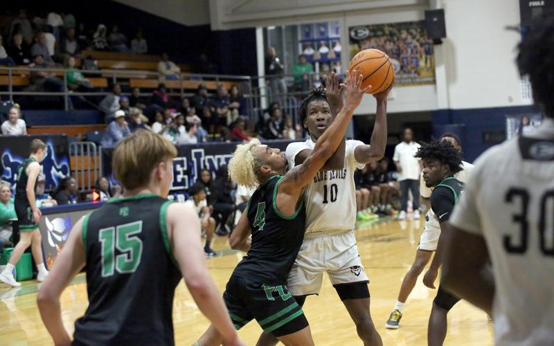 A.J. Brown (10) goes up for a basket in the lane against Franklin County . (File photo  by Bo Underwood)