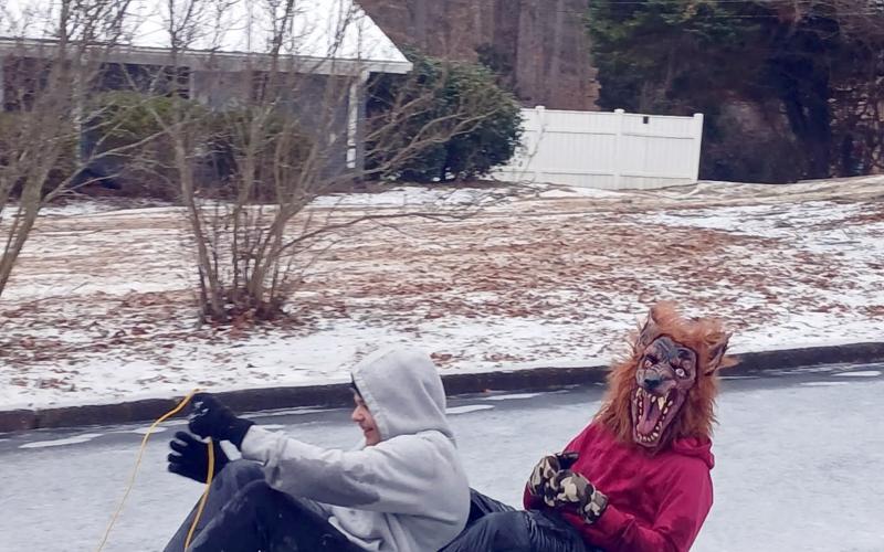 Starrett Blackmon and Cassin Andrews go sledding in a wolf mask after the winter storm. (Photo submitted by Jamie Blackmon)