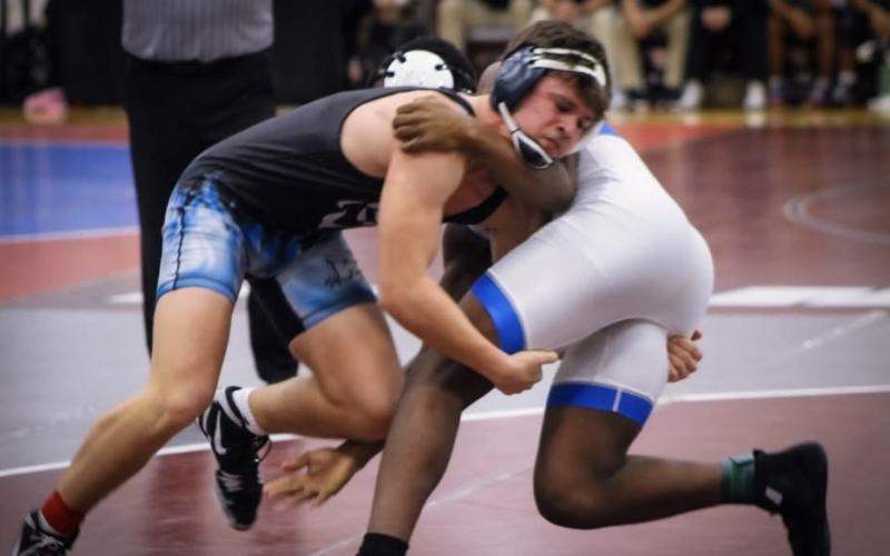 Brycin Hughes wrestles with his opponent. (Photo courtesy of April Dixon Hughes)