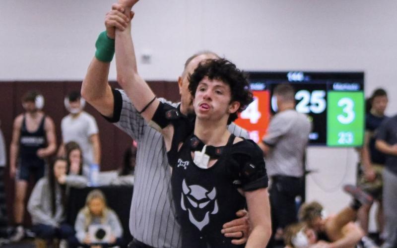 Lane Fleming is declared the winner of his match. (Photo courtesy of April Dixon Hughes)