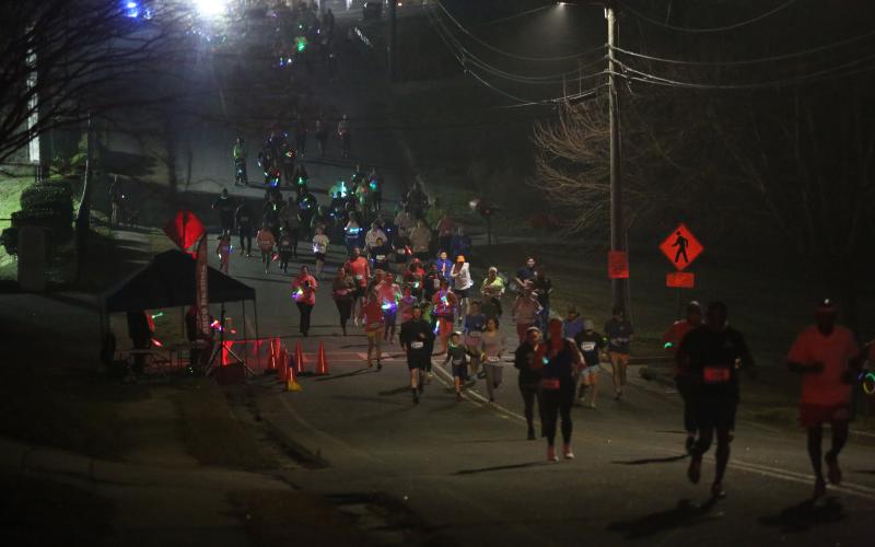 A total of 157 participants ran in the Twilight Stroll by the Granite Bowl Jan. 9. The event was a "glow run" and runners donned neon apparel and accessories. (Photo by Mark Wells)