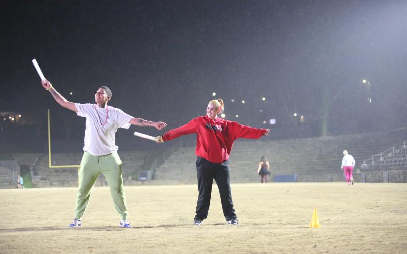 The neon lights were not too bright for the runners in the annual Twilight Stroll by the Granite Bowl Jan. 9. This year’s run was designated as a “glow run” and runners donned neon and fluorescent clothes and accessories to light up the night during the run. (Photos by Mark Wells)