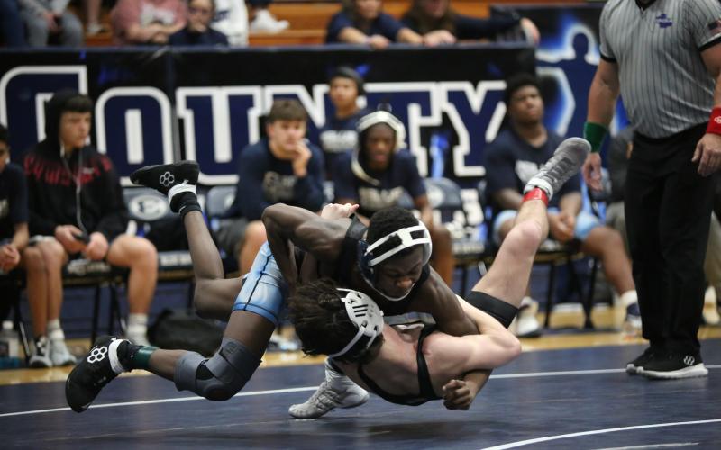 Jayden Thompson takes down his opponent. (Photo by Mark Wells)