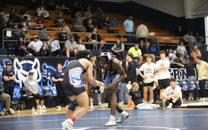 Javares Bowman (above) offers a grin as he faces his opponent (Photo by Mark Wells)