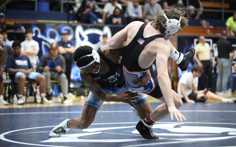 Jayden Thompson prepares to pin his opponent. (Photo by Wells)
