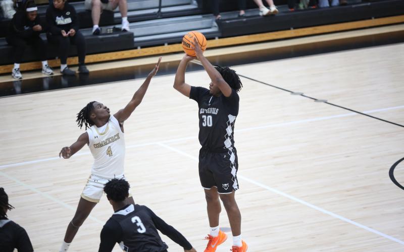 Jase Mattox shoots the ball during a Jan. 13 game against Commerce. (File photo by Bo Underwood)