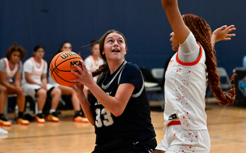 Freshman Bryleigh Dickerson (33) gets the ball in the paint. (Photo courtesy of Sean Gallagher)