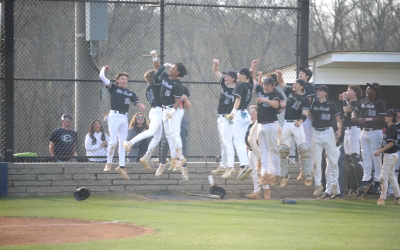 Teammates celebrate senior Sam Amabile’s first of two home runs during Friday’s doubleheader. (Photo by Bo Underwood)