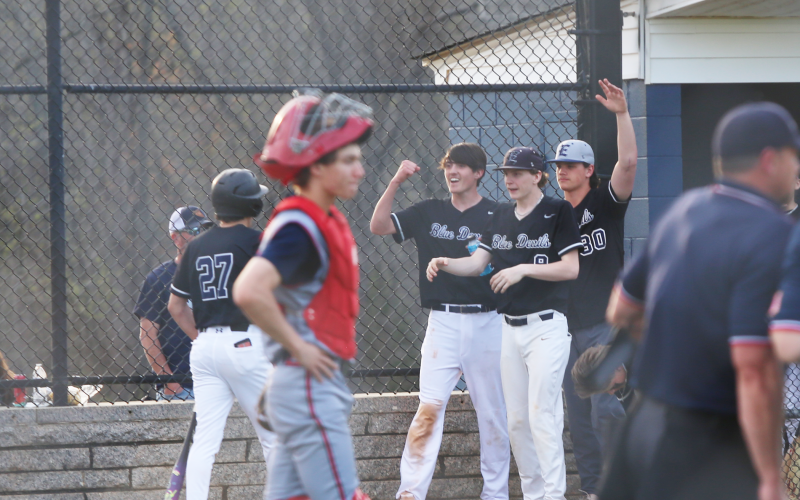 Members of the Elbert County dugout greet Rylan Brown after a run. (Photo by Bo Underwood)