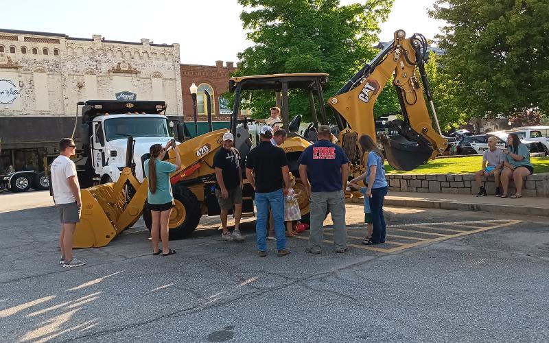 The City of Elberton held its first Touch-a-Truck event April 23 on the downtown square. The event featured a square-full of various working vehicles from school buses to well-drilling rigs. (Photos by Beth Yeary)