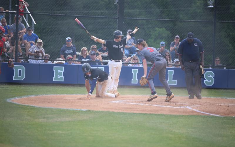 Alex Higginbotham signals "safe" as Jackson Black slides into home. (Photo by Bo Underwood)