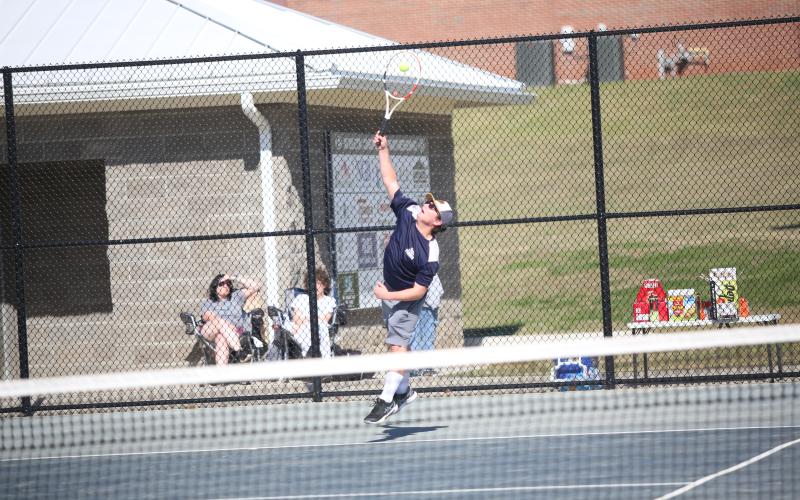 Adrian Jenkins serves the ball. (Photo by Bo Underwood)