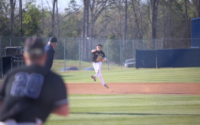 Brayden Ingram makes a throw from shortstop. (Photo by Bo Underwood)
