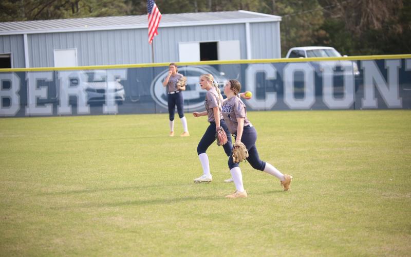 Carlee Brown makes a throw from right field. (Photo by Bo Underwood)
