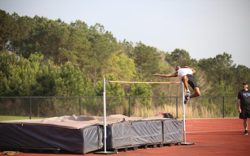 Jordan Morrison competes in the high jump. (Photo by Bo Underwood)