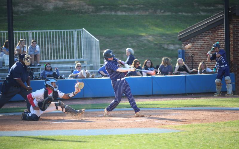 Alex Higginbotham hits a home run in Elbert’s win over Banks County on April 7. (Photo by Bo Underwood)