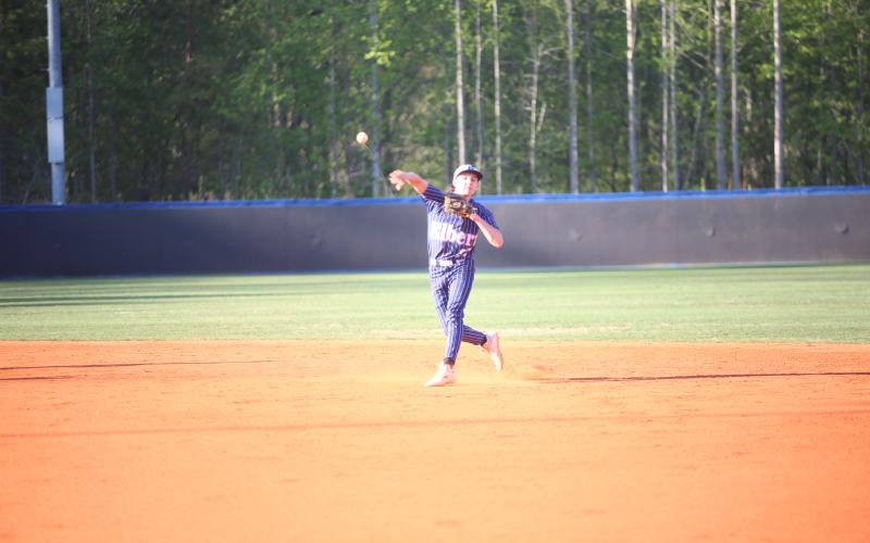 Rylan Brown makes a throw in Elbert's win over Banks County on April 7. (Photo by Bo Underwood)