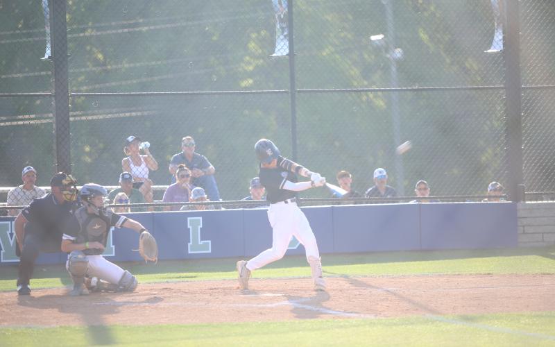Sam Amabile hits the ball. (Photos by Bo Underwood)