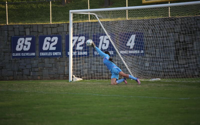 Kendall Hudson makes a save. (Photo by Bo Underwood)