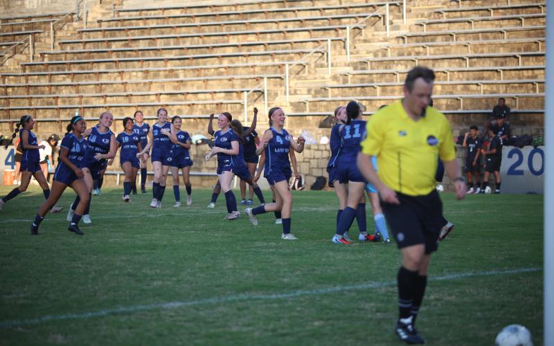 The Elbert County girls' soccer team celebrates its season-ending win over Lincoln. (Photo by Bo Underwood)