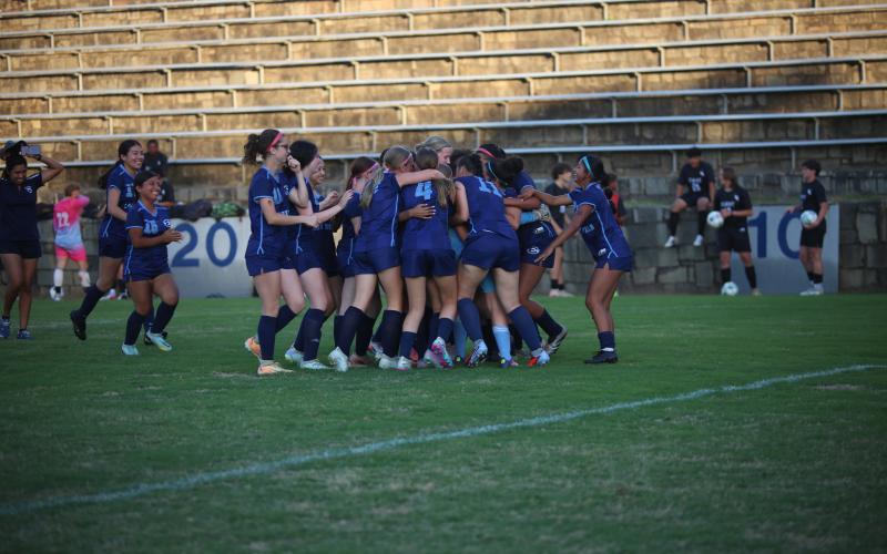 The Elbert County girls' soccer team celebrates its season-ending win over Lincoln. (Photo by Bo Underwood)