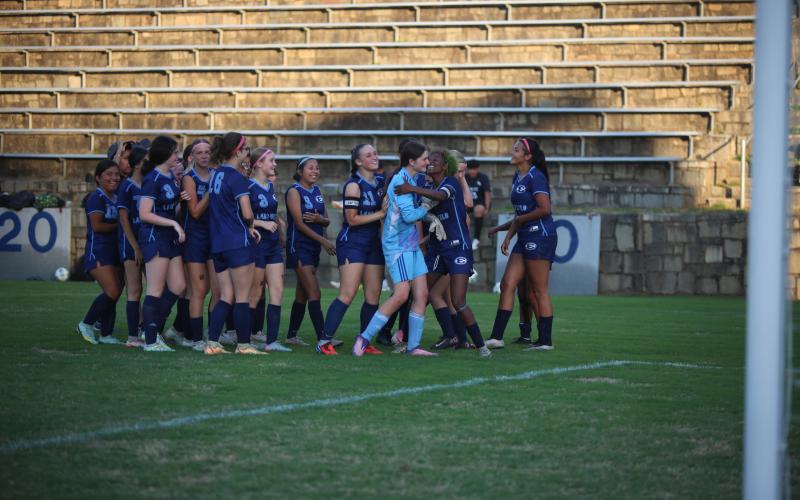 The Elbert County girls' soccer team celebrates its season-ending win over Lincoln. (Photo by Bo Underwood)