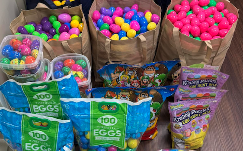 Bags stuffed full with Easter eggs wait in city hall. (Photo by Crystal Beebe)