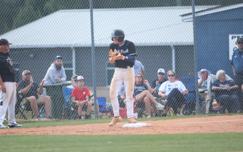 Jackson Black claps after hitting a triple. (Photo by Bo Underwood)