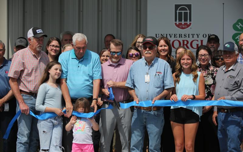 Lee Vaughn cuts the ribbon at the grand opening of Elbert County's new 4-H facility. (Photo by Bo Underwood)