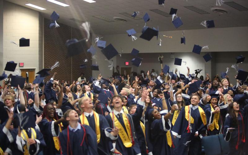 The Elbert County Comprehensive High School Class of 2026 dodged some rainy weather and held their graduation ceremony inside Elbert County Elementary School May 22. Regardless of the venue change the class was unable to resist the urge to toss their caps in the air after the completion of the ceremony. (Photo by Bo Underwood)
