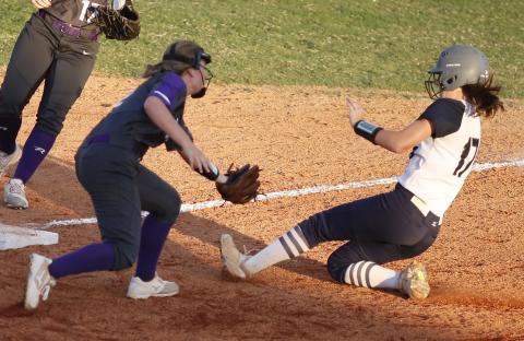 ady Blue Devil junior Madelyn Diaz (left) slides safely into third base during the sixth inning of Elbert County’s 2-1 loss to Union County Aug. 28 at King Field in Elberton. (Photo by Cary Best)