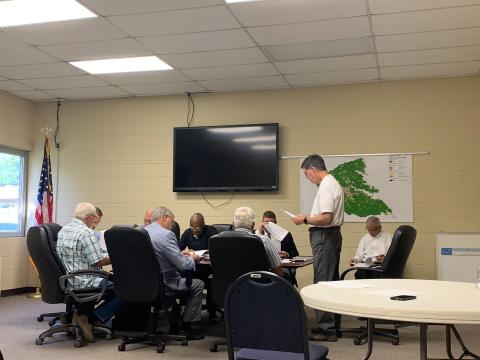 Phil Pitts announces the proposed mill rates to the Elbert County Board of Commissioners. (Photo by Rose Scoggins)
